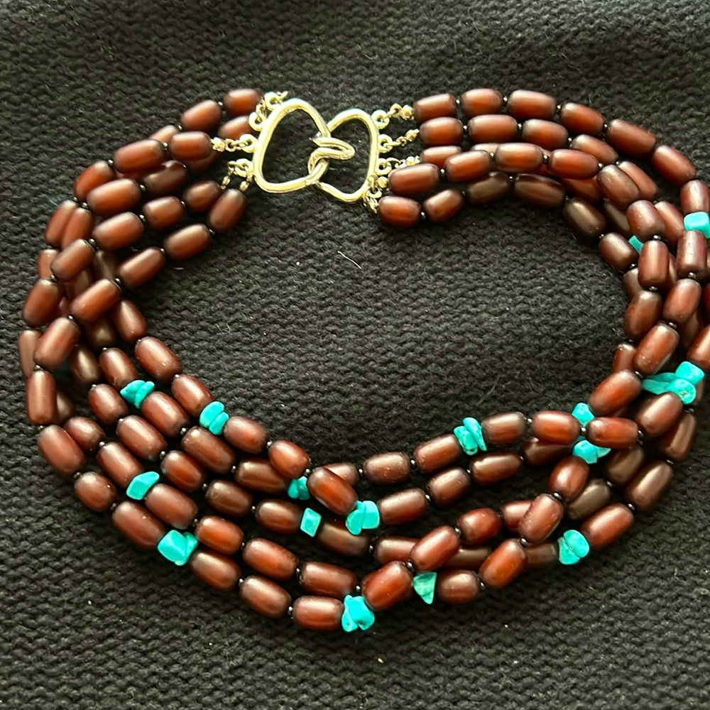 Multi strand wooden necklace with faux turquoise stones